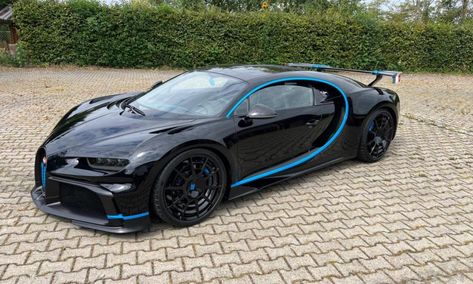 A Bugatti Chiron Pur Sport is up for at the German dealer Griesheimer & Eisele. The limited edition hypercar is being offered for $5.07 million. This Chiron Pur Sport is finished in an all-black exterior with blue C graphics, blue ‘Bugatti’ text on the spoiler and the number 16 painted on the grille. The latter […] The post Bugatti Chiron Pur Sport for sale with a price tag of $5 million appeared first on The Supercar Blog. Bugatti Chiron Pur Sport Black, Bugatti Chiron Black, Bugatti Super Sport, Blue C, Luxurious Cars, Tesla Car, Pimped Out Cars, Bugatti Chiron, Car Cleaning Hacks