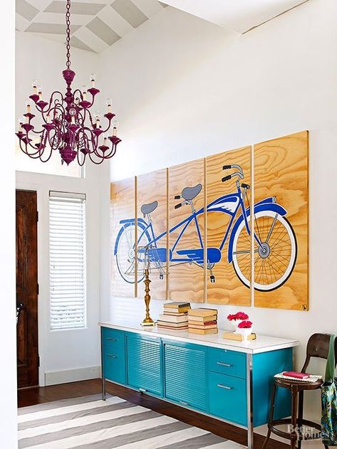 This foyer makes such a big statement on entering the house. Patterned ceiling, huge statement art (painted on plywood!) and that turquoise metal cabinet is awesome. | 100+ Beautiful Mudrooms and Entryways at Remodelaholic.com Front Entry Decor, Entry Decor, Metal Lockers, Elegant Chandeliers, Foyer Decorating, Large Living Room, Better Homes And Gardens, Living Room Wall, Entryway Decor