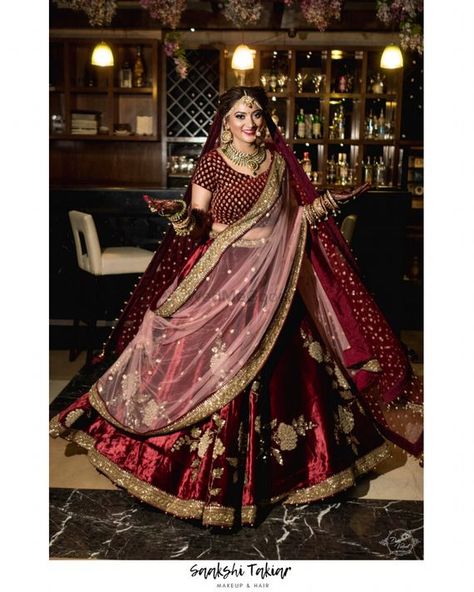 Photo of A bride in maroon lehenga and double dupatta twirling Lehenga With Double Dupatta, Maroon Bridal Lehenga, Double Dupatta, Maroon Lehenga, Latest Bridal Lehenga Designs, Winter Wedding Planning, Bridal Lehenga Designs, Lehenga Jewellery, Latest Bridal Lehenga