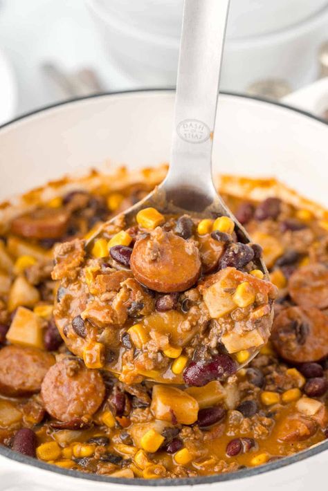 Texas Cowboy Stew is a hearty dish loaded with ground beef, smoked sausage, bacon, potatoes, corn, beans and diced tomatoes all in a flavourful beef broth. Texas Cowboy Stew, Beef Smoked Sausage, Classy Recipes, Ground Beef Stew Recipes, Cowboy Soup, Hamburger Potato Soup, Meat Church, Cowboy Stew, Camp Meals