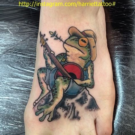 Frog playing banjo tattoo by me Traditional Banjo Tattoo, Animal Playing Banjo Tattoo, Frog Playing Banjo On Mushroom, Frog With Banjo Tattoo, Frog With Guitar Tattoo, Sitting Frog Tattoo, Frog Guitar Tattoo, Frog Tattoos Traditional, Frog Playing Guitar Tattoo