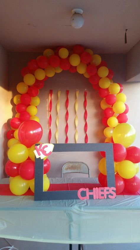 A DIY Kansas City Chiefs photo booth. You'll be the best party host ever. #kc #chiefs www.crowleyfurniture.com Kc Chiefs Party Decorations, Diy Kansas City Chiefs Party Decorations, Kansas City Chiefs Party Decorations, Kc Chiefs Party Ideas, Kc Chiefs Snacks, Kc Chiefs Superbowl Party, Chiefs Birthday Party Ideas, Diy Kansas City Chiefs Decor, Kc Chiefs Birthday Party