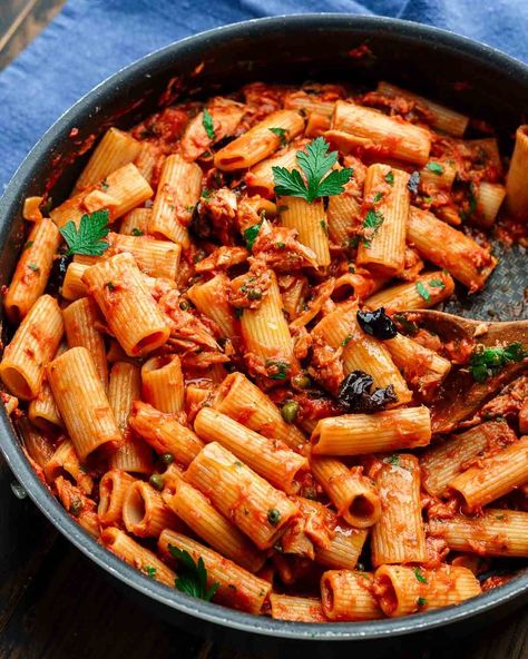 Pasta al tonno combines oil-packed yellowfin tuna, capers, olives, and anchovies in a simple tomato sauce that's simmered and tossed with al dente pasta. This one's so easy to make and comes together in about 30 minutes! #tunapasta #pastaaltonno #easypastarecipes Tuna Pasta Italian, Pasta With Tuna And Olives, Tuna Olive Pasta, Pasta With Tuna And Capers, Tuna Pasta Tomato Sauce, Recipes With Anchovies, Olive Pasta Recipes, Tuna And Pasta, Pasta Tuna