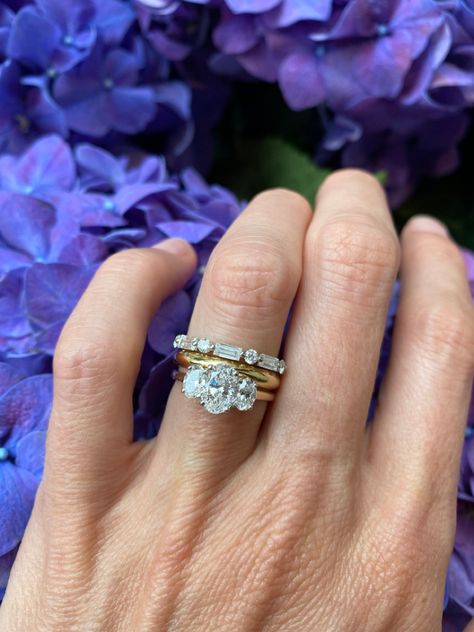 In love with this stacking ring combination 🌟 Trilogy oval diamond ring with our sifnature D shaped wedding band and a round and baguette eternity band 👀 #Sophiebreitmeyer #oneofakind #bespoke #Modernfamilyjeweller #SBwedding #finejewelery #diamond Bands For Three Stone Rings, Three Stone Ring With Band, Oval Diamond Ring With Baguettes, 3 Stone Engagement Rings With Wedding Band, Wedding Band With Trilogy Ring, Three Ring Stack, Oval Trilogy Engagement Ring With Wedding Band, Three Stone Wedding Band, Mixed Stone Wedding Band