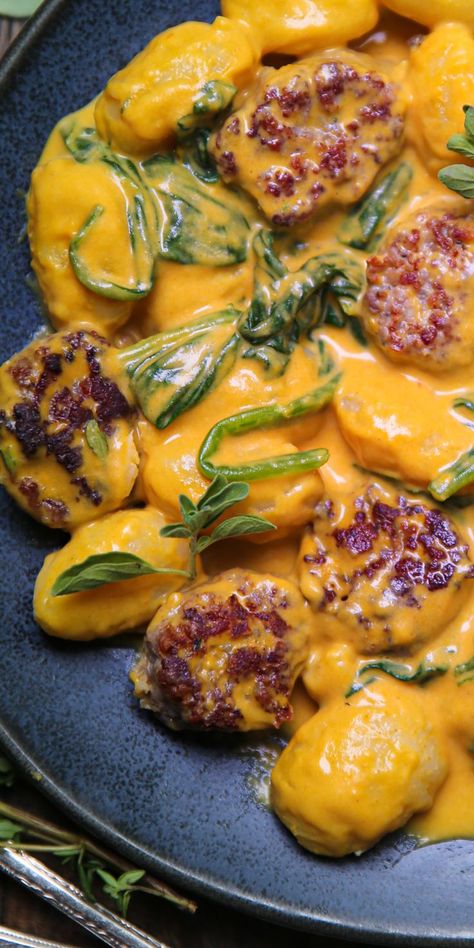 Creamy Pumpkin Gnocchi with Spinach and Sausage on a blue plate. Creamy Pumpkin Gnocchi, Recipes With Pumpkin Gnocchi, Fall Gnocchi Recipes, Gnocchi And Sausage Recipes, Pumpkin Gnocchi Recipes, Turkey Gnocchi, Pumpkin Sausage Pasta, Gnocchi With Spinach, Squash Gnocchi