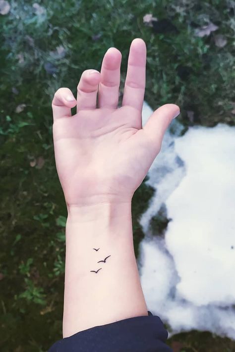 32 Lovely Wrist Tattoo Ideas – IdeasDonuts Tatoos Wrist Women, Bird Memorial Tattoos For Women, Danty Tattoos Women Wrist, Mini Bird Tattoos For Women, 2 Birds Flying Tattoo, Tattoo For The Wrist, Small Bird Wrist Tattoo, Micro Bird Tattoos For Women, Small Simple Wrist Tattoos