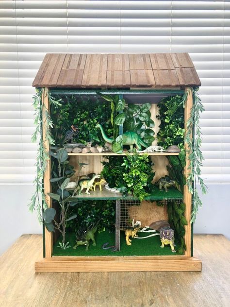 Diy Dinosaur Play Area, Dinosaur Dolls House, Dinosaur Organization Ideas, Dinosaur Habitat Diy, Dinosaur Doll House Diy, Dino Dollhouse, Dinosaur Storage Ideas, Boys Dollhouse Diy, Dinosaur Doll House