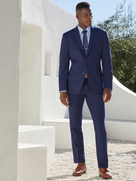 This slim fit suit jacket from Perry Ellis is a stylish and versatile option for any occasion. The dobby fabrication is characterized by miniature geometric patterns woven into the fabric, giving it a unique and eye-catching look. The 4-way stretch provides added flexibility and comfort, while the wrinkle-resistant finish ensures that you'll look your best all day long. 65% Polyester / 28% Viscose / 7% Elastane Slim Fit Dobby Fabrication Is Characterized By Miniature Geometric Patterns Woven Int Navy Suit Men's Outfit, Wedding Men Suit Blue, Formal Wedding Suits Men, Male Wedding Guest Outfit Formal, Men’s Wedding Guest Attire Spring Formal, Men Wedding Suits Classy, Men’s Blue Suit, Blue Suit Wedding Guest, Mens Suit Wedding Guest