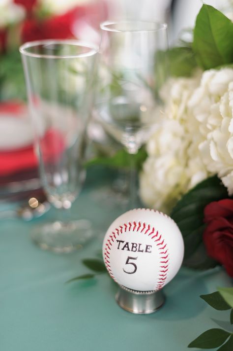 Table numbers were a simple baseball. Baseball Table Numbers, Baseball Theme Table Decorations, Baseball Wedding Decor, Baseball Theme Wedding, Baseball Themed Wedding, Baseball Table Decorations, Baseball Wedding Ideas, Baseball Rehearsal Dinner, Softball Wedding