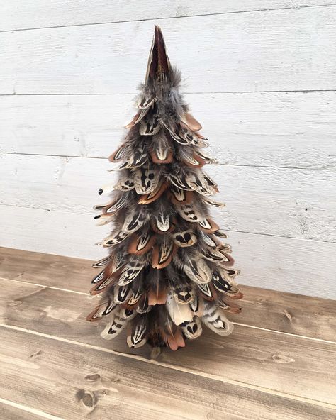 <p>Handmade Pheasant feather tree with a willow log base. Beautiful unique Christmas or all year decoration that wondefully symbolises the shape of a tree and its leaves.</p><p>Approx Height: 13 inches</p><p>Please note that each tree is handmade and unique therefore the feathers may vary from shown.</p> Feather Crafts Ideas, Modern Christmas Diy, Pheasant Feather Decor, Feather Ideas, Feather Crafts Diy, Chicken Feathers, Feather Wreath, Pheasant Feather, Chicken Crafts