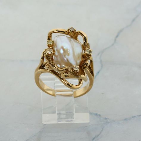 14K Yellow Gold Pearl and Diamond Ring, interesting asymmetrical design, Ring size 6.5, 8.7 grams Stock # R00070 This listing contains photographs of the actual item you will receive.  Our items are in excellent condition with little or no signs of wear and many are one of a kind pre-owned estate finds.   Please look closely at the pictures in this listing as they are part of the product description. Please read the description, as any imperfections or condition comments will be included.  We do our best to accurately describe the condition of each piece and encourage you to ask questions prior to purchase.    We are happy to address any questions you may have.  Please contact us.  Our Store has many other items for sale.  We specialize in fine & designer jewelry, watches & more.    Coloni Vintage Ring Wedding, Handmade Fine Jewelry Rings, Pearl And Gold Jewelry Aesthetic, Inlaid Engagement Rings, Vintage Italian Engagement Rings, Pearl And Gold Engagement Ring, Antique Engagement Rings Vintage 1920s Gold, Gold Engagement Ring With Silver Band, Art Nouveau Engagement Ring Antique