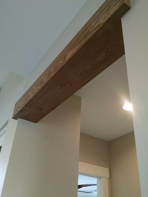 Faux Support Beam, Attic Entry Ideas Ceilings, Beam Header Doorway, Box Beams Ceiling, Wood Beams In Hallway, Doorway Faux Beam, Basement Soffit Ideas Ceilings, Wood Beam With Crown Molding, Wood Beam Top Of Doorway