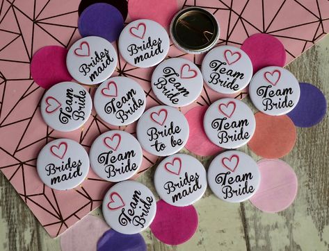 Cute pink love heart Team Bride - Wedding themed badges 💖 💍 https://buff.ly/3RZh5IJ #weddingideas #teambride #bridetobe #henparty #badges #isaidyes #imgettingmarried #handmadewedding #weddingfavours #badgemaker #bride2024 #weddingplanning Wedding Badges Ideas, Lagan Lakhan, Mehandi Decoration, Budget Friendly Wedding Favours, Islamic Frames, Indian Wedding Songs, Wedding Badges, Pink Love Heart, Badge Maker