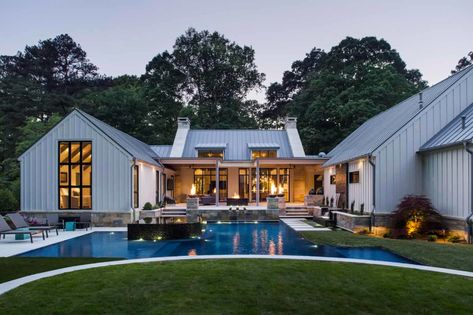 Welcoming modern farmhouse boasts exceptional details in Georgia Farmhouse Pool, Farmhouse Exterior Design, Harrison Design, Fresh Farmhouse, Unique Farmhouse, Modern Farmhouse Design, Modern Farmhouse Exterior, House With Porch, Contemporary Farmhouse