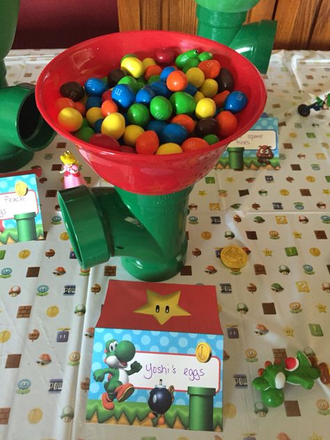 Yoshi Eggs Mario Party, Yoshis Crafted World Party, Super Mario Candy Table Ideas, Princess Peach Party Decorations Diy, Yoshi Themed Birthday, Yoshi Birthday Party Ideas, Mario Bros Food Ideas, Yoshi Egg Hunt, Yoshi Birthday Party