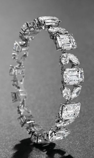 A MAGNIFICENT DIAMOND BRACELET, BY VAN CLEEF & ARPELS   Set with eleven rectangular-cut diamonds, weighing approximately 5.71 to 2.72 carats, interspersed by twin marquise-shaped diamond links, 1966, 17.0 cm, with French assay marks for platinum and gold  Signed Van Cleef & Arpels, no. 9.324CS Van Cleef & Arpels, Fabulous Jewelry, Van Cleef Arpels, Van Cleef, Gorgeous Jewelry, Dream Jewelry, Diamond Bracelets, Marquise Cut, Silver Diamonds