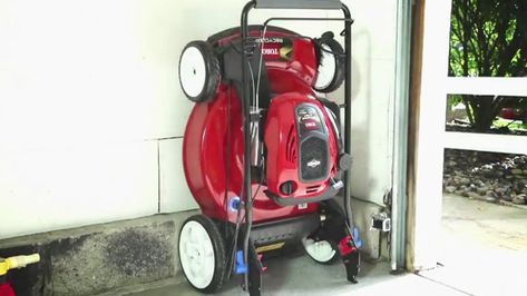 Save space in your garage or shed by switching to this SmartStow lawn mower that has a folding handle and a special engine to allow the mower to be stored vertically against a wall without any leaks! Lawnmower Storage, Lawn Equipment Storage, Mower Storage, Garage Organizer, Organizing Tools, Lawn Mower Storage, Van Racking, Pallet Shed, Lawn Care Business