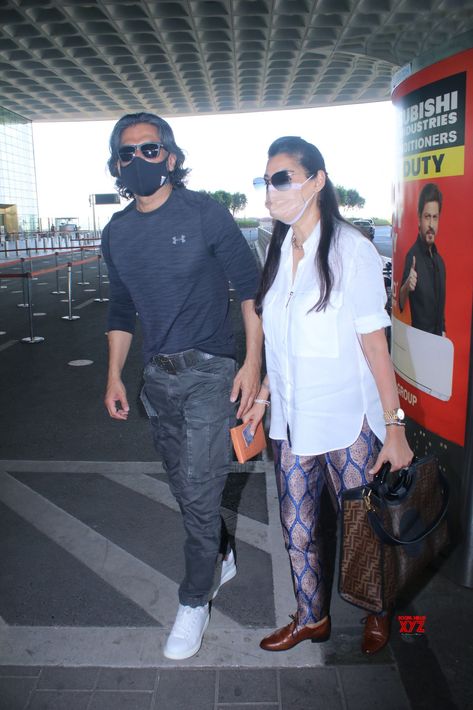 Sunil Shetty And His Wife Mana Shetty Spotted At Airport Departure - Gallery #SunilShetty #ManaShetty Bollywood News, Bollywood Celebrities, Actors, Celebrities