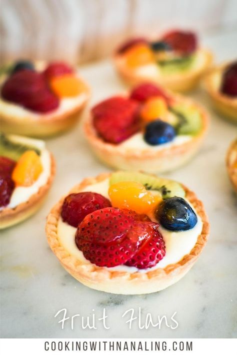 mini tart shell filled with custard and topped with fruit slices Fruit Flan Recipe, Sweet Shortcrust Pastry Recipe, Fruit Flan, Fruit Cake Recipe Easy, Mini Tart Shells, Shortcrust Pastry Recipes, Fruit Pastries, Fruit Toppings, Fruitcake Recipes