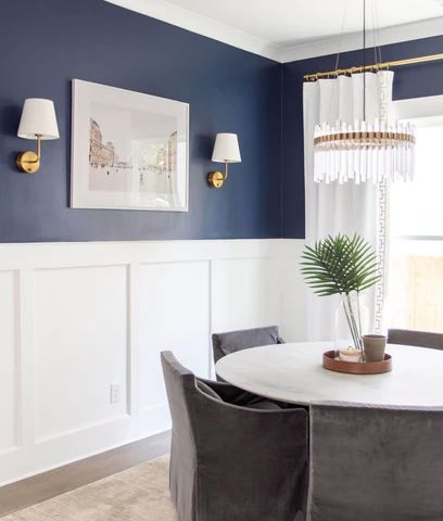 How To Update Your Dining Room Using Cordless Wall Sconces White Panelling Blue Walls, Navy Blue And Gold Dining Room, White Paneling Walls, Navy Living Rooms, Dining Room Wainscoting, White Wainscoting, Gold Living, Trellis Panels, Dining Room Blue