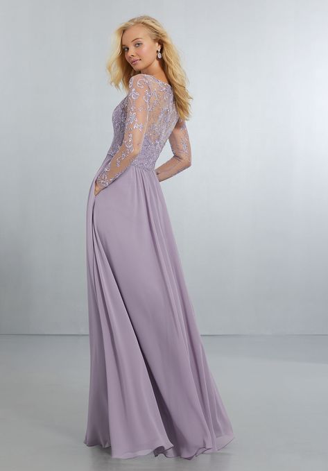 Flowing Chiffon, A-Line Gown with Delicately Beaded Embroidery on Mesh Bodice with Long Sleeves with Covered Button Detail at the Wrist. The V-Neckline Flows Around to the Illusion Back with Zipper. View Chiffon Swatch Card for Color Options. Shown in French Lilac. Lace Sleeve Bridesmaid Dress, Mori Lee Bridesmaid Dresses, Purple Bridesmaid Dress, Mesh Bridesmaids Dress, Long Sleeve Bridesmaid Dress, Bridesmaid Dresses Uk, Rose Bridesmaid Dresses, Bridesmaid Dresses With Sleeves, Dress Colors