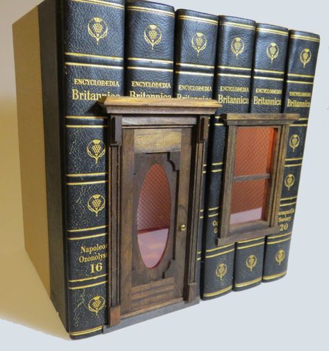 So here's something that absolutely needs a place in my cabinet of curiosities– book houses! Real books, "hollowed-out" and filled with a miniature vignette setting, complete with tiny scaled wallpaper and parquet flooring. They come from a little-known artist I found in the far corners of the net, Book Village, Miniature Buildings, Miniature Shop, Miniature Book, Book Sculpture, Miniature Rooms, Cabinet Of Curiosities, Fairy Doors, Book Folding