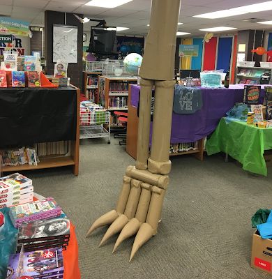 Dinovember At The Library, Dinosaur Display, Make A Dinosaur, Book Fairs, Fair Theme, Scholastic Book Fair, Library Events, Dinosaur Decor, Library Displays