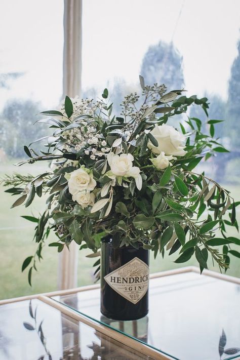 Gin bottles make brilliant vases for elaborate floral centrepieces #weddingideas #weddinginspiration #ginweddingideas #centrepieces Olive Grove, Unique Wedding Flowers, Wedding Floral Centerpieces, Flower Centerpieces Wedding, Wedding Table Decorations, Botanical Wedding, Ideal Wedding, Wedding Table Centerpieces, Wedding Guide