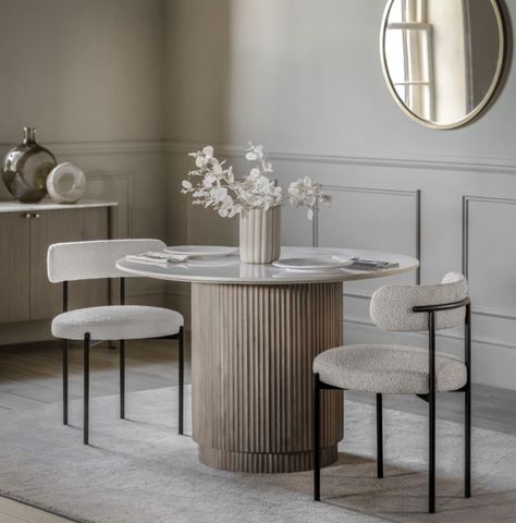 Offering a modern classic look, this stunning Ravenna Round Dining Table, White Marble Top, Mango Wood Base exudes timeless quality and beauty. It is crafted from solid mango wood, with a striking vertical ribbed feature on the drum base, and a polished Indian white Carrera marble top with classic grey/blue veins running through it. Matching pieces available. Click Here To Shop The Complete Collection Dimensions: (w)1100mm x (d)1100mm x (h)750mm Colour: Grey Wash / White Materials: Mango Wood, M White Round Dining Table, Mango Wood Dining Table, Blue Veins, Round Marble Dining Table, Marble Top Dining Table, Carrera Marble, Classic Grey, Solid Mango Wood, Marble Table