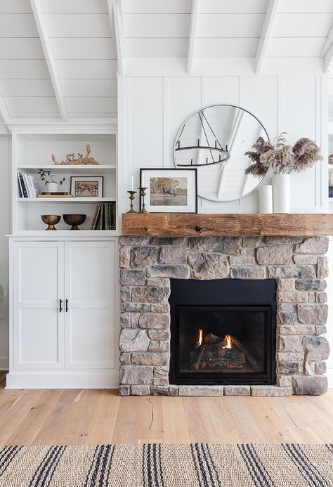 Gas Fireplace Not Shiplap, Cottage Gas Fireplace, Gas Fireplace With Stone Surround, New England Style Fireplace, Lake Cottage Fireplace, Gray And White Fireplace, Gray Stone Fireplace Farmhouse, Driftwood Fireplace Mantle, Minimalist Fall Mantle Decor