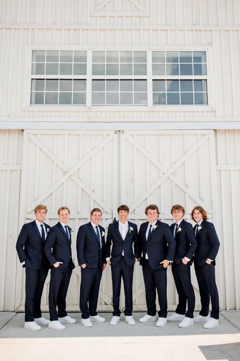 Groom and groomsmen wearing matching navy suits with white nike sneakers for a fresh yet casual look for this The White Dove Barn Wedding in Nashville, TN | John Myers Photography & Videography Wedding With Friends, White Nike Sneakers, John Myers, Cocktail Hour Music, Groomsmen Poses, Groomsmen Style, Navy Suits, Nashville Wedding Venues, Custom Cufflinks