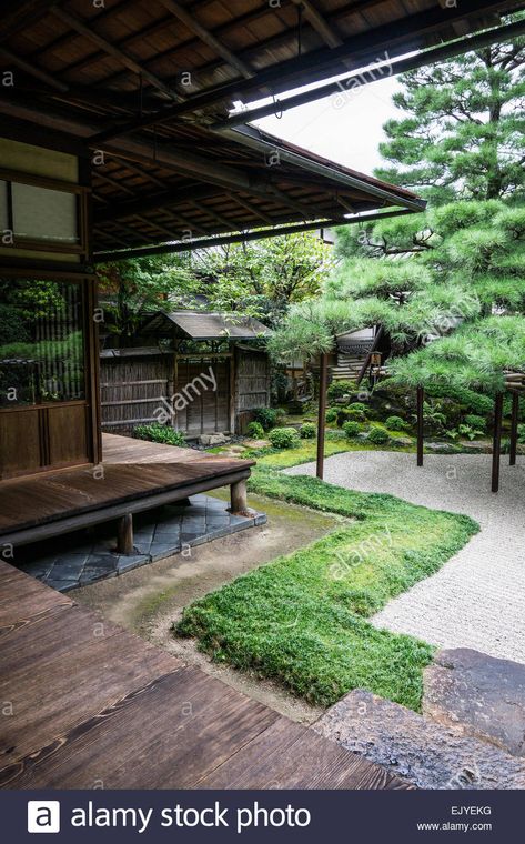 View of a traditional Japanese garden with wooden veranda and raked gravel in Kyoto, Japan Stock Photo Japanese Veranda Design, Japanese Veranda, Genkan Ideas, Traditional Japanese House Exterior, Best Tiny House Designs, Wooden Veranda, Japanese Courtyard House, Japanese House Exterior, Japanese Courtyard Garden