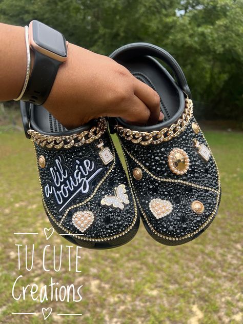 Each rhinestone is placed one by one and gives your shoe a beautiful sparkle. *Gold Charms may vary with availability* Black Crocs With Charms, Decorated Crocs, Crocs With Charms, Bedazzled Shoes Diy, Bling Crocs, Cross Shoes, Bedazzled Shoes, Custom Crocs, Bling Converse