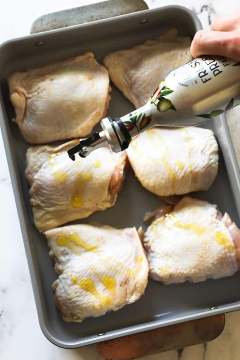 The flavor of these perfectly roasted chicken thighs is incredible. This easy 5-ingredient oven-baked bone-in chicken thigh recipe is the perfect staple recipe and easy weeknight dinner. These low-carb chicken thighs are super-juicy with the crispy skin you want. Use this recipe for meal prep and batch cooking too. | Real Simple Good Quick Bone In Chicken Thigh Recipes, Skinned Chicken Thigh Recipes, Baked Chicken Thigh Recipes Bone In, Chicken Thighs With Bone And Skin, Bone In Chicken Thigh And Leg Recipes, Skin On Bone In Chicken Thigh Recipes Baked, Oven Baked Bone In Chicken Thighs, Easy Bone In Chicken Thigh Recipes, Roasted Chicken Thigh Recipes