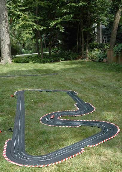 sandbox racing track 3 Outdoor Car Track For Kids, Kids Race Track, Car Tracks For Kids, Race Car Track, Backyard Toys, Kids Races, Diy Projects For Kids, Backyard Inspo, Outdoor Playground