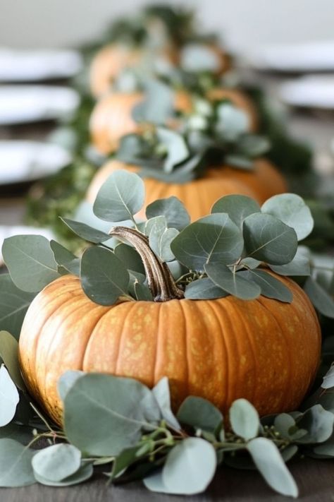 Craft stunning DIY centerpieces with pumpkins and eucalyptus for a natural, earthy Thanksgiving table decoration. #DIYCenterpieces #PumpkinDecor Centerpieces With Pumpkins, Thanksgiving Table Decoration, Eucalyptus Centerpiece, Diy Pumpkin, Diy Centerpieces, Centerpiece Ideas, Fall Table, Thanksgiving Ideas, Thanksgiving Table