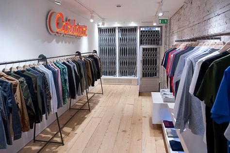 Carhartt Work In Progress store, London Cloth Shop Interior Design Small Spaces, Small Clothing Store Interior Shops, Small Clothes Shop Design, Small Clothing Store Interior, Carhartt Store, Cloth Display, Small Shop Design, Clothes Shelves, Church Interior Design