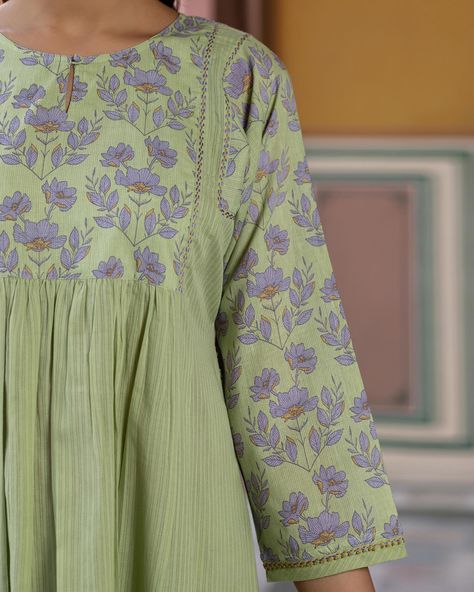 Summer 2024 - New Arrivals! The Poppy Gathered Kurta is crafted with a flowing fit and a lightweight fabric that billows softly around you with every gentle breeze. Reflecting the dreamy palette of a poppy meadow, this printed cotton kurta is a delicate blend of sage and lavender. [ Cottons Jaipur, New Arrivals, Cotton, Floral, Handmade Kurtas, Everyday-wear, Summer staples ] #cottons #cottonsjaipur #newarrivals #floral #summer #summer2024 #handcraftedkurtas #comfortfits #cottonsuitset #s... Cottons Jaipur, Ladies Kurti Design, Salwar Kurti, Dreamy Palette, Sage And Lavender, Ladies Kurti, Pleated Dresses, Churidar Designs, Dress Neck