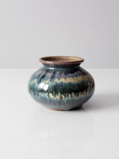 "This is a vintage studio pottery vase.  Signed by the artist, the bulbed handmade vase has a stunning fired glaze with rich blue, turquoise, purple, russet, and cream tones. CONDITION In good condition with wear consistent with age and use.  MEASUREMENTS Height: 4\"  ..  10.2 cm Diameter: 5\"  .. 12.7 cm 22336" Throwing Wheel Pottery, Vases Pottery, Ceramics Pottery Vase, Pottery Glaze, Sun Burn, Vase Collection, Art Deco Table, Handmade Vase, Cream Tones