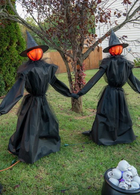 Add some spirit by building these DIY Halloween witches. Made with easy to find supplies and glowing heads! They are life sized, easy to store, and no-sew. Includes step by step instructions and video. Halloween Witch Theme Outdoor, Halloween Outside Decorations Diy Witches, How To Make Outdoor Halloween Witches, Diy Outdoor Halloween Witches, Halloween Witches Diy, Life Size Witch Diy, Outdoor Witches Diy, Diy Witch Outdoor Decoration, Witch Theme Halloween Decor Outside