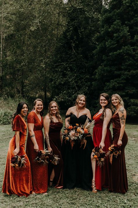 Bridal Party With Black Wedding Dress, Fall Wedding Burgundy And Black, Black Wedding Dresses With Bridesmaids, Halloween Themed Wedding Bridesmaid Dresses, Nontraditional Fall Wedding, Black Wedding Dress Orange Bridesmaids, Dark Moody Wedding Bridesmaid Dresses, Fall Wedding Black Dress, Black Wedding Dress Red Bridesmaid