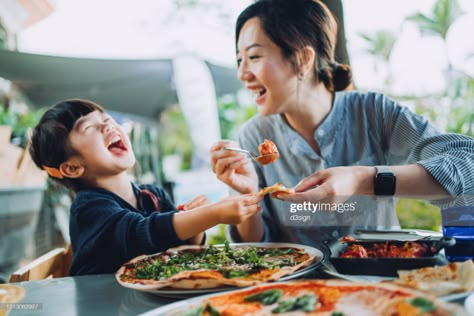 Stock Photo : Joyful young Asian mother and lovely little daughter enjoying pizza lunch in an outdoor restaurant while mother serving meatballs and bolognese to daughter. Family enjoying bonding time and a happy meal together. Family and eating out lifestyle Asian Mother, Mother Daughter Photoshoot, Pizza Lunch, Eat Happy, Family Lunch, Food Photoshoot, Family Restaurant, Eat Together, Lifestyle Photography Family