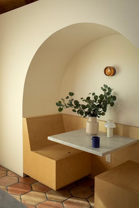 Photo 1 of 33 in Kitchen idea by Office Horimoto from Before & After: A Highland Park Fixer-Upper Sings With a New Archway Motif - Dwell Dining Room Table Bench, Mos Eisley Cantina, Mos Eisley, Carrera Marble, Table Bench, Terracotta Tiles, Dining Nook, Accent Lighting, Wall Lighting