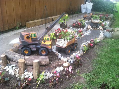 Truck Garden Ideas, Front Porch Landscape, Truck Garden, Garden Statuary, Tonka Trucks, Porch Landscaping, Garden Rocks, Tonka Truck, Fairy Garden Diy