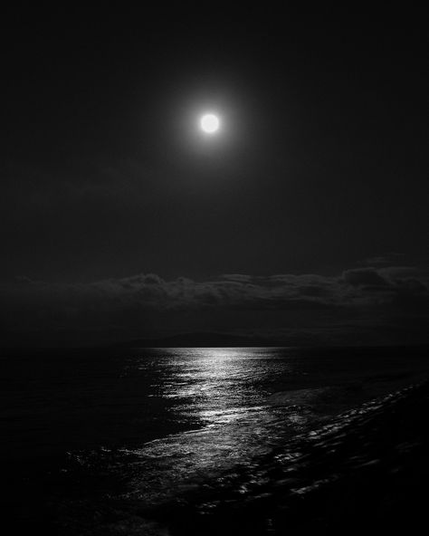 "Print Title - Moon Glow Introducing \"Moon Glow,\" a black and white photographic artwork capturing the captivating beauty of a full moon night in Maui, Hawaii. Taken from the rocky shoreline of Kalama Park, Maui, this artwork immortalizes the moon's ethereal glow reflecting over the ocean, guiding the viewer's gaze towards the distant island of Lanai. Presented in classic black and white, the image emits a modern romantic sensibility, transforming any space into a serene oasis. Ideal for sparking conversations, \"Moon Glow\" will surely become a cherished addition to your decor. Key Details ◦ Modern black and white full moon artwork photograph ◦ Premium archival lustre paper ensures lasting quality ◦ Sizes: 8x10, 11x14, 16x20, 20x24, 24x30, 40x50 ◦ Comes unmatted, ready for your personal