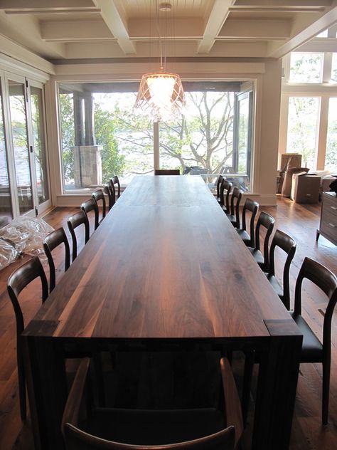 With its rich walnut finish and timeless design, picture this custom 16' long solid walnut dining table in your home!! Pair it with solid wood chairs, or a matching bench, the options are endless.  Visit our website to see more - we look forward to hearing from you. Giant Dining Table, Long Walnut Dining Table, Really Long Dining Table, Big Kitchen Table Ideas, Large Wood Table Dining Rooms, Diy Solid Wood Dining Table, 6 Ft Dining Room Table, 20 People Dining Table, 16 Seater Dining Table