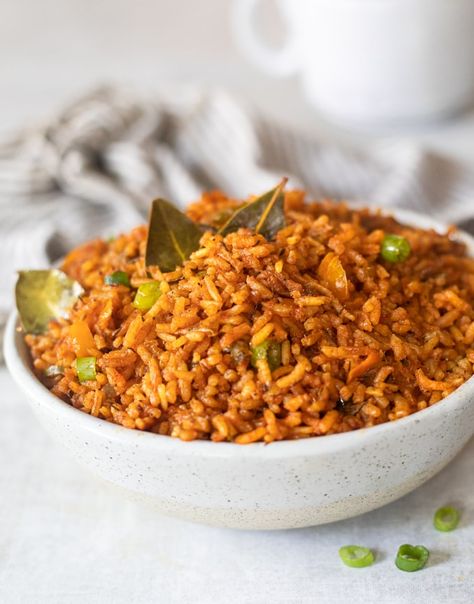 Jollof rice is staple dish in West Africa. This vegan meal is cooked in a flavorful tomatoes, onions and peppers stew. Even non vegans will love it! Vegan Bread Pudding, Collard Greens Salad, Sweet Fries, Sweet Potato Biscuits, Veggie Lasagna, Jollof Rice, Nigerian Food, Plantains Fried, Vegetable Stew