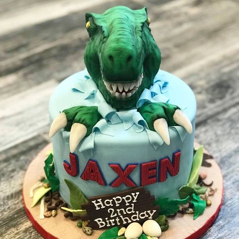 Dinosaur theme birthday cake Three Year Old Dinosaur Birthday Cake, Raptor Cake Dinosaurs, Scary Dinosaur Cake, Dianousor Cake Design, Dinosaur Cake 5th Birthday, Dinsors Cake, Dinousar Cake Ideas, Dinosaur Cake 4th Birthday, Dinosaur 4th Birthday Cake