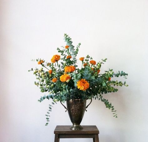 orange marigolds eucalyptus Flower Arrangements With Marigolds, Marigold Fall Decor, Orange Wedding Reception Decor, Marigold Floral Arrangement, Marigold Flower Arrangements, Marigold Bouquet Wedding, Marigold Arrangements, Marigold Wedding Bouquet, Marigold And Eucalyptus