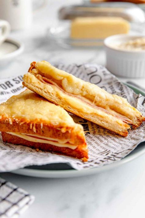 Croque Monsieur is a delicious Ham and Cheese sandwich. This French-inspired recipe is baked in the oven until the cheese melts. Serve for brunch or lunch. #frenchrecipes #jernejkitchen #croque #bread #toast #brunch Sandwich Photography, Lunch Toast, Asian Steak Bites, Creamy Pasta Bake, Ham And Cheese Sandwich, Delicious Magazine, Beautiful Food Photography, Bread Toast, Mood Food